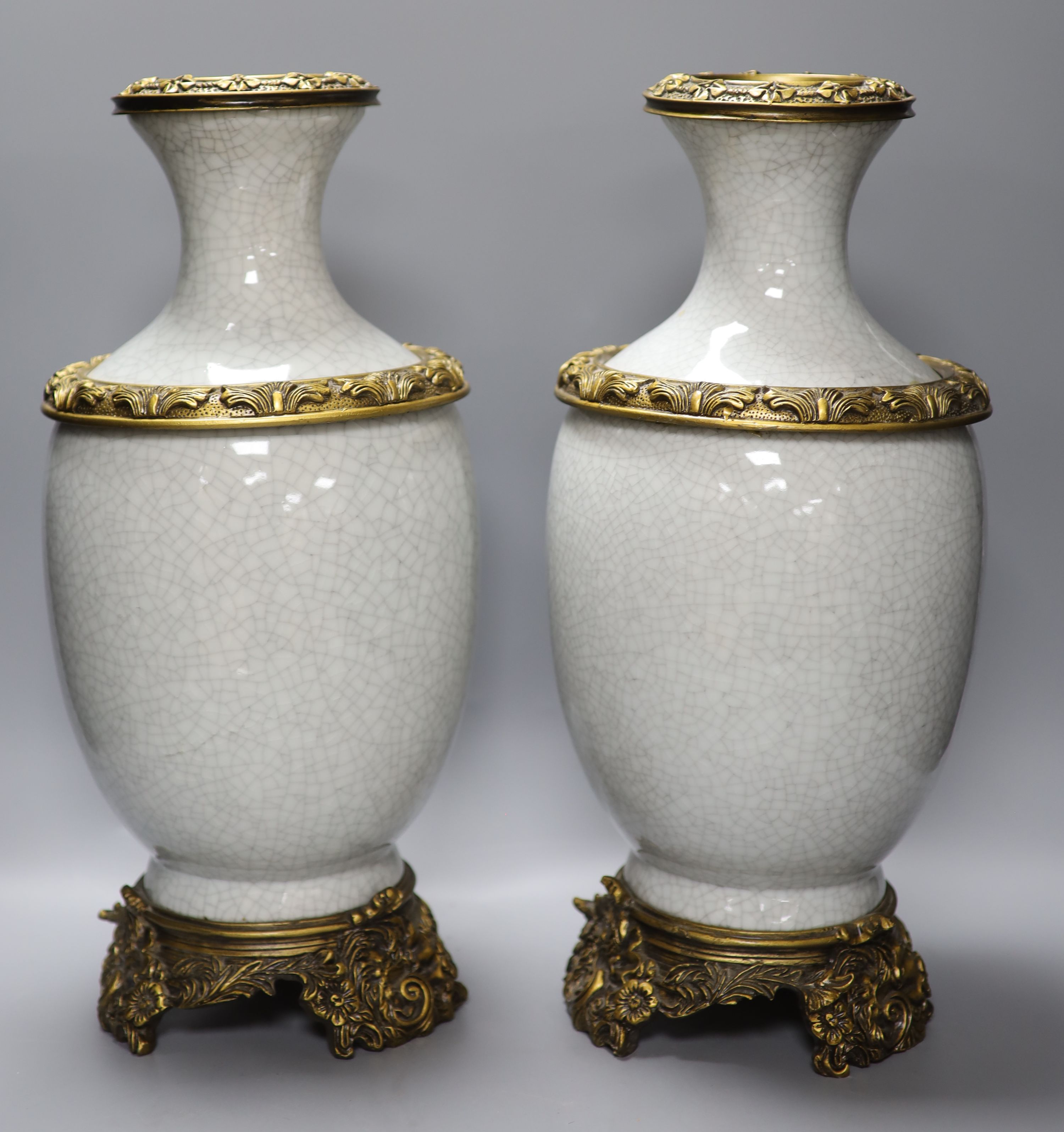 A pair of Chinese crackleglaze vases and a blue and white vase and cover, height 43cm